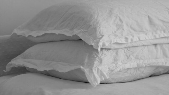 A made bed in a bedroom
