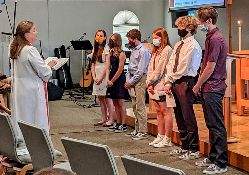 A group of people standing in a room