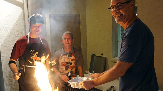 A man cooking over a fire