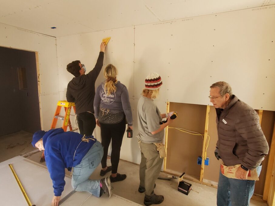 A group of people standing in a room