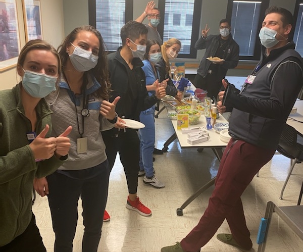 A group of people standing in a room