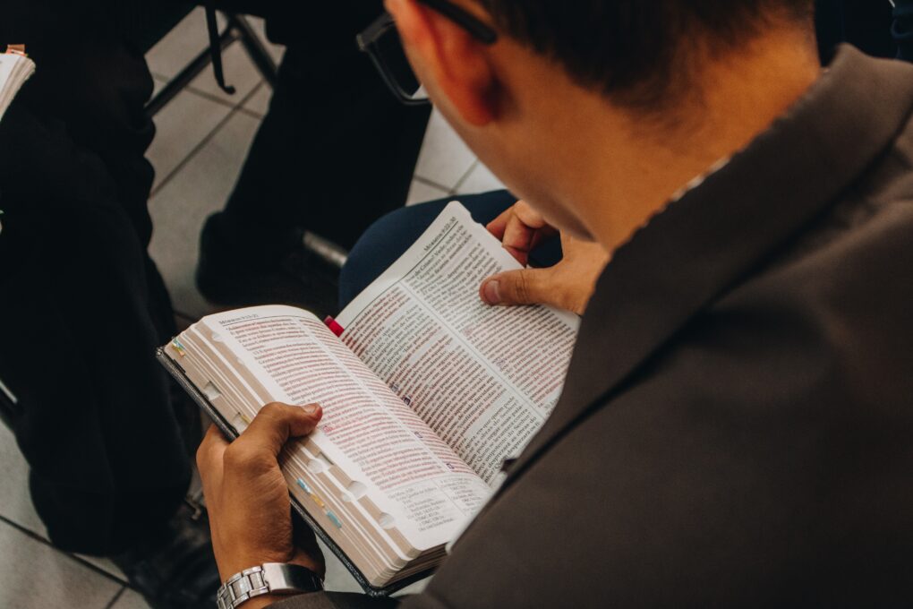 A man sitting with a bible