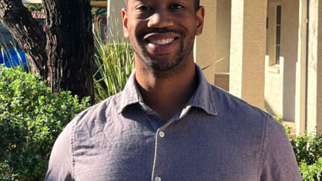 A man standing in front of a building