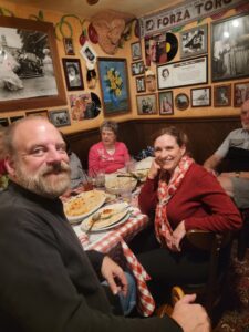 A group of people eating food at a restaurant