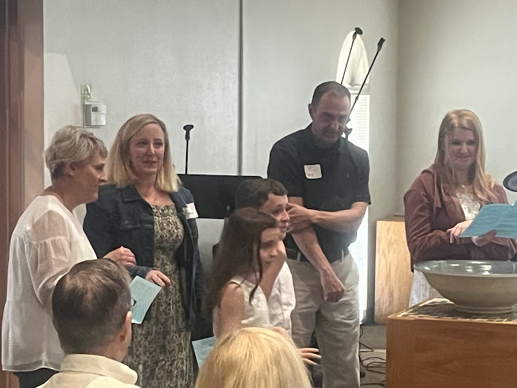 A group of people standing in a room