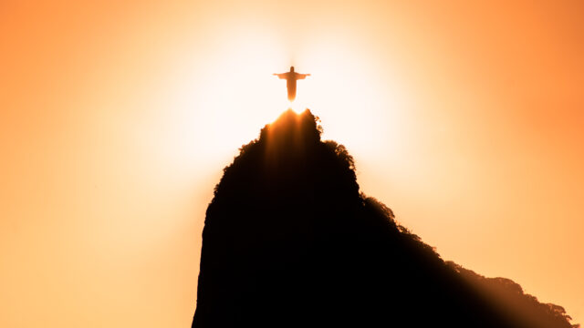 The sun is setting in front of a sunset
