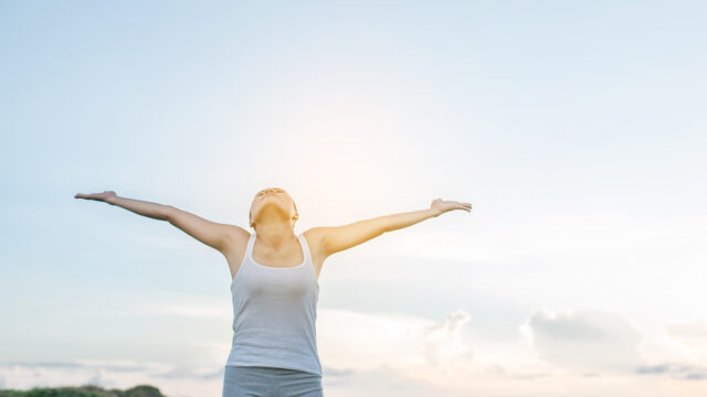 Beautiful Woman feeling free in a beautiful natural setting.