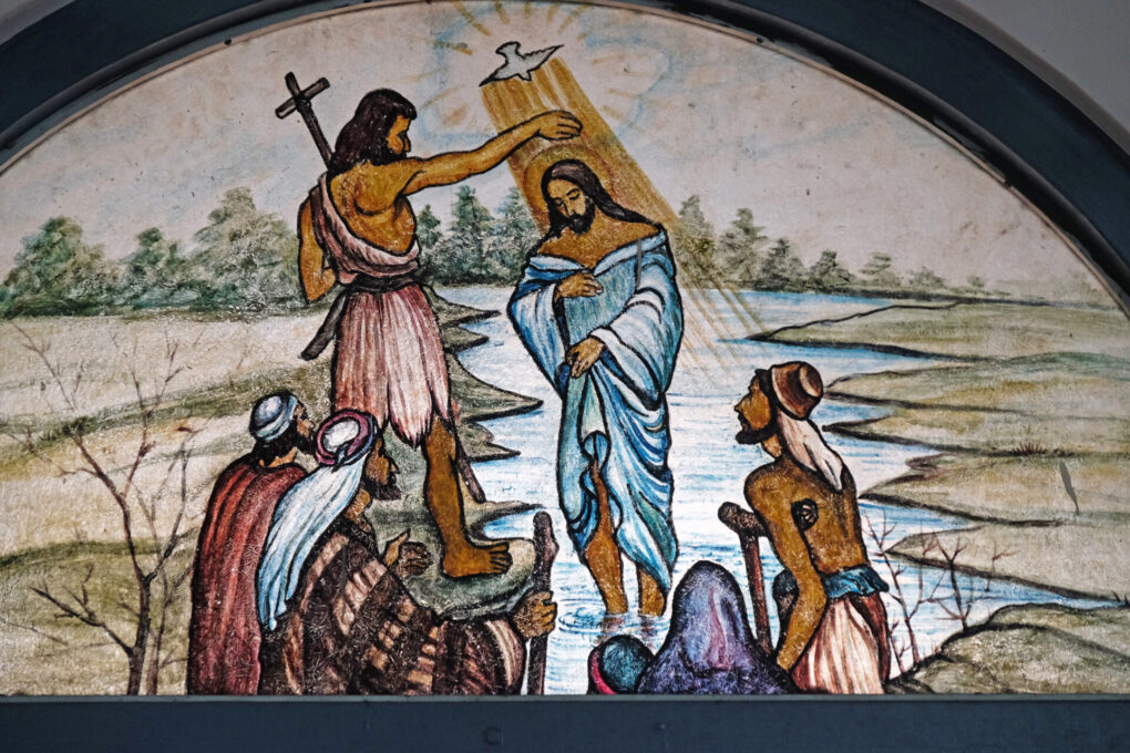 Baptism of the Lord, stained glass in the Catholic cathedral of Immaculate Heart of Mary and St. Teresa of Calcutta in Baruipur, West Bengal, India