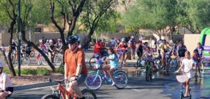 A group of people riding on the back of a bicycle