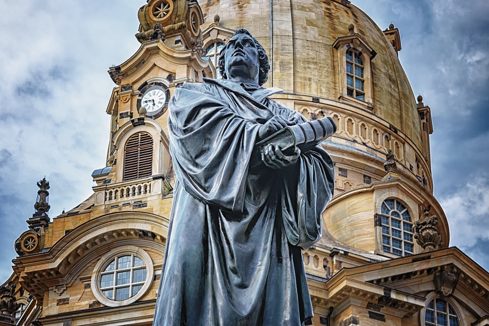 A clock tower in front of a building