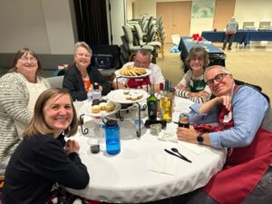 A group of people sitting at a table