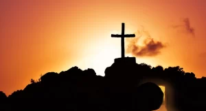 A single cross on a hillside.