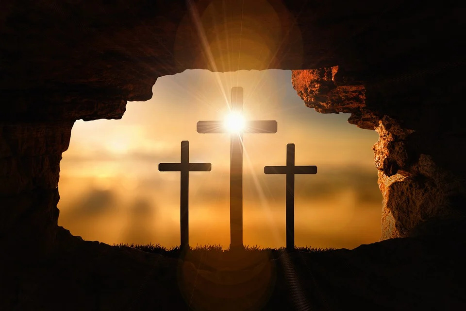 A cave opening with three crosses.
