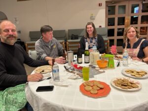 A group of people sitting at a table