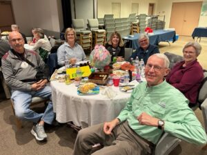 A group of people sitting at a table