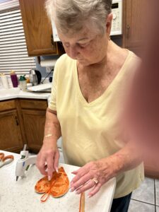 A man cutting a slice of pizza