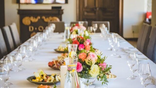 A dining table with wine glasses