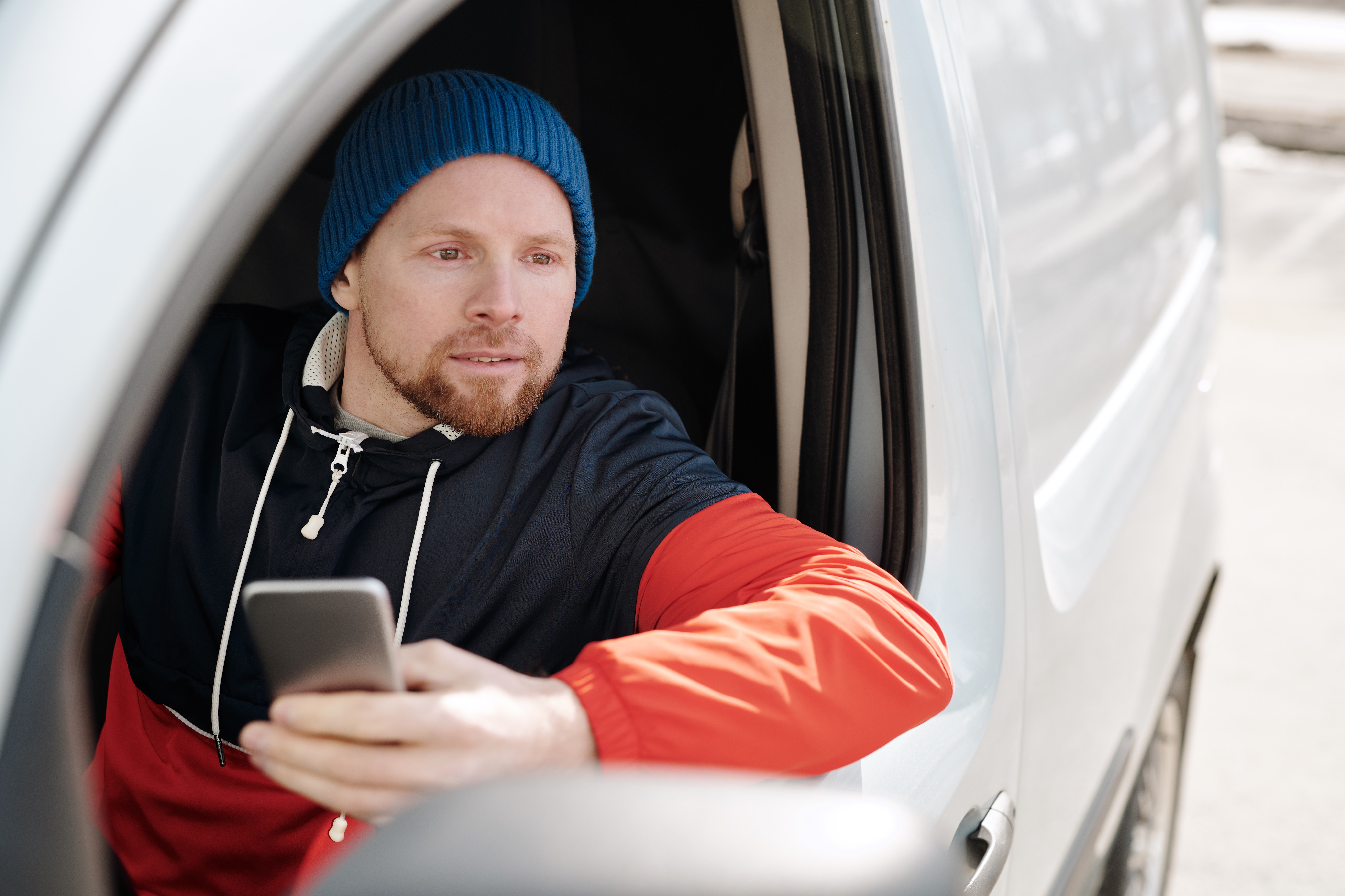 man in a van with a mobile phone