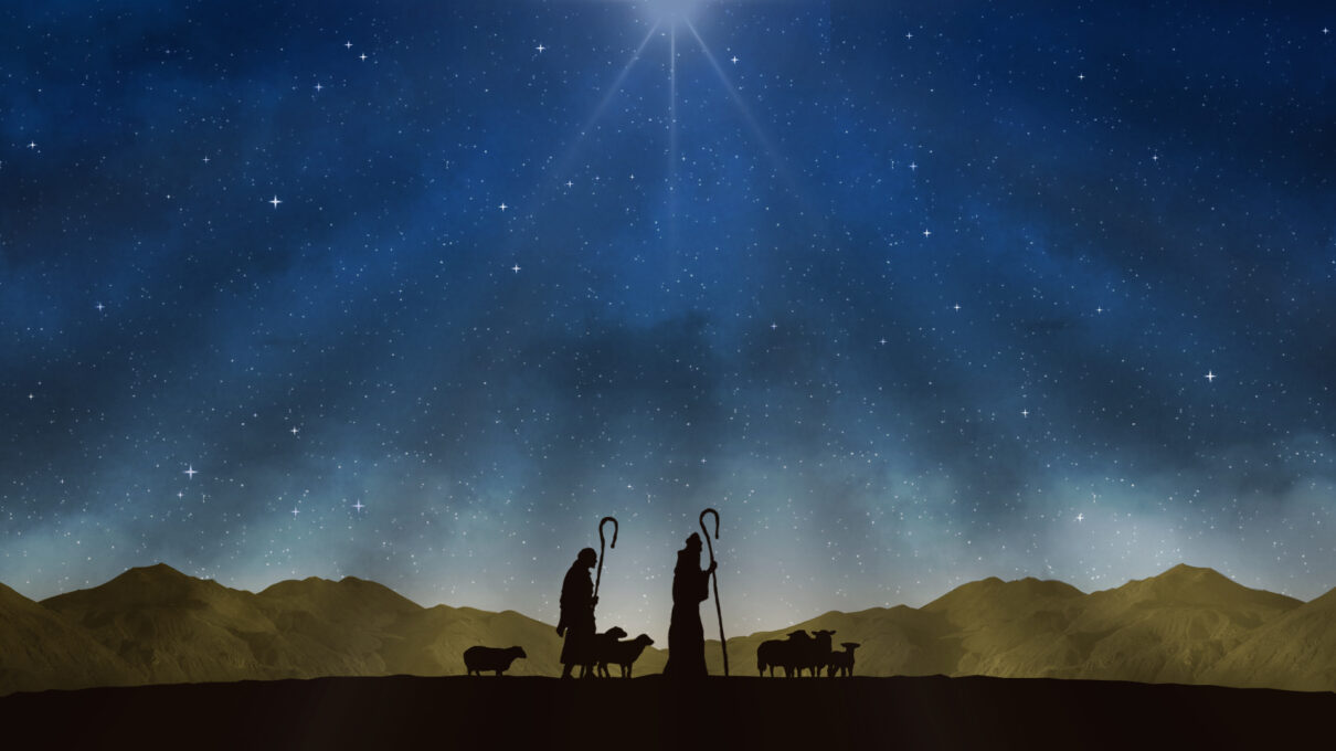 shepherds walking with sheep, with hills in the background