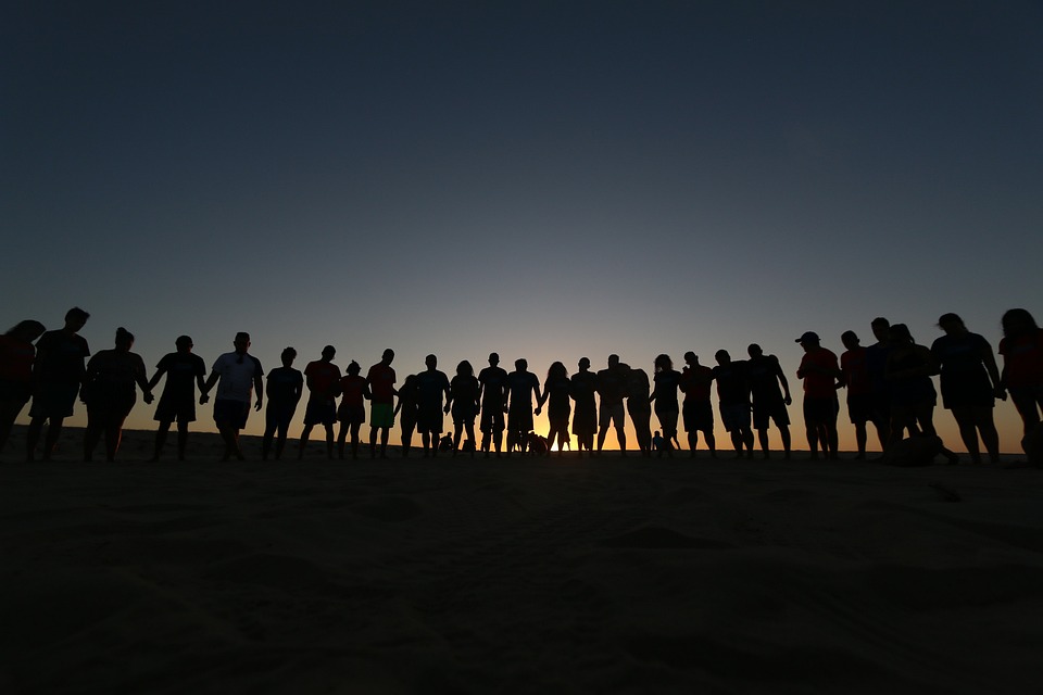 A group of people standing next to a line